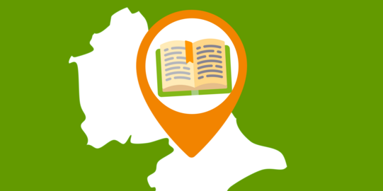 Ausschnitt einer Landkarte, in dem ein aufgeschlagenes Buch zu sehen ist