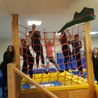 Female students climbing on a climbing frame at Fluvium