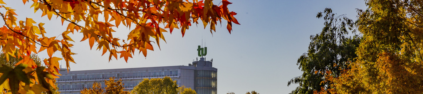 The building of the Department of Mathematics with trees in autumn colors.